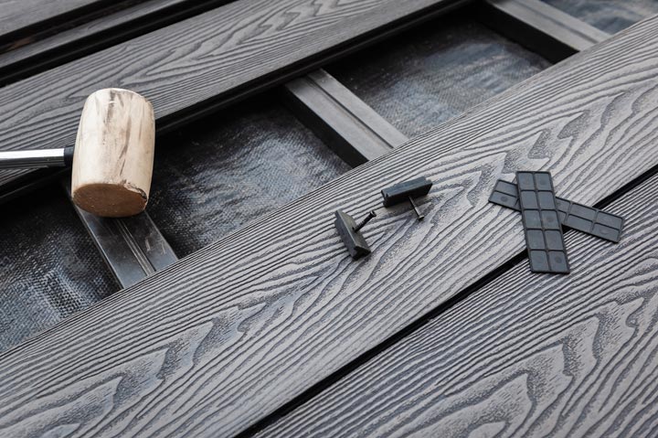 installation of composite decking with rubber mallet