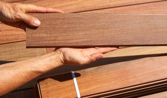man holding individual ipe wood decking board
