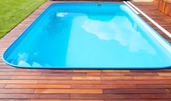 beautiful Ipe wood decking around clear water swimming pool