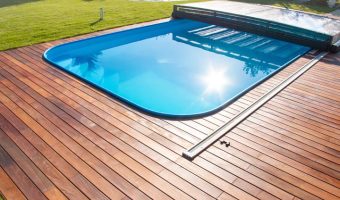 sunshine reflecting off backyard pool surrounded by Ipe decking